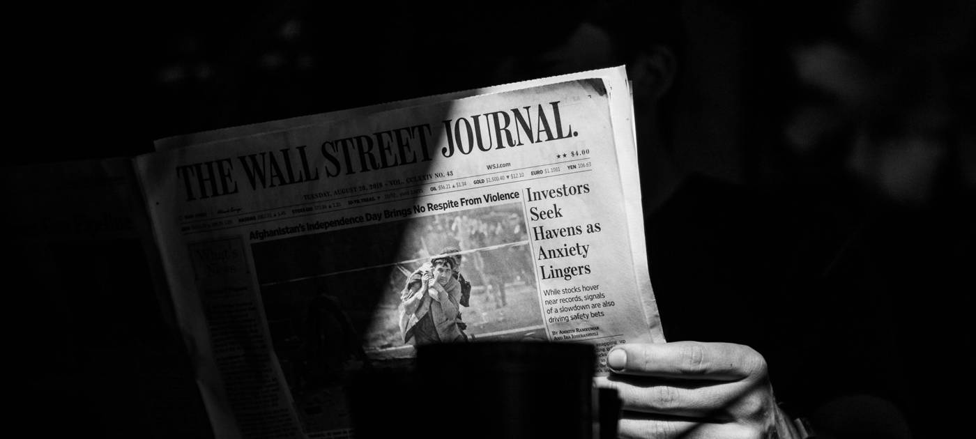 Investor reading financial news